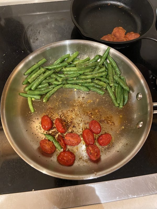 beans and tomatoes in a pan.