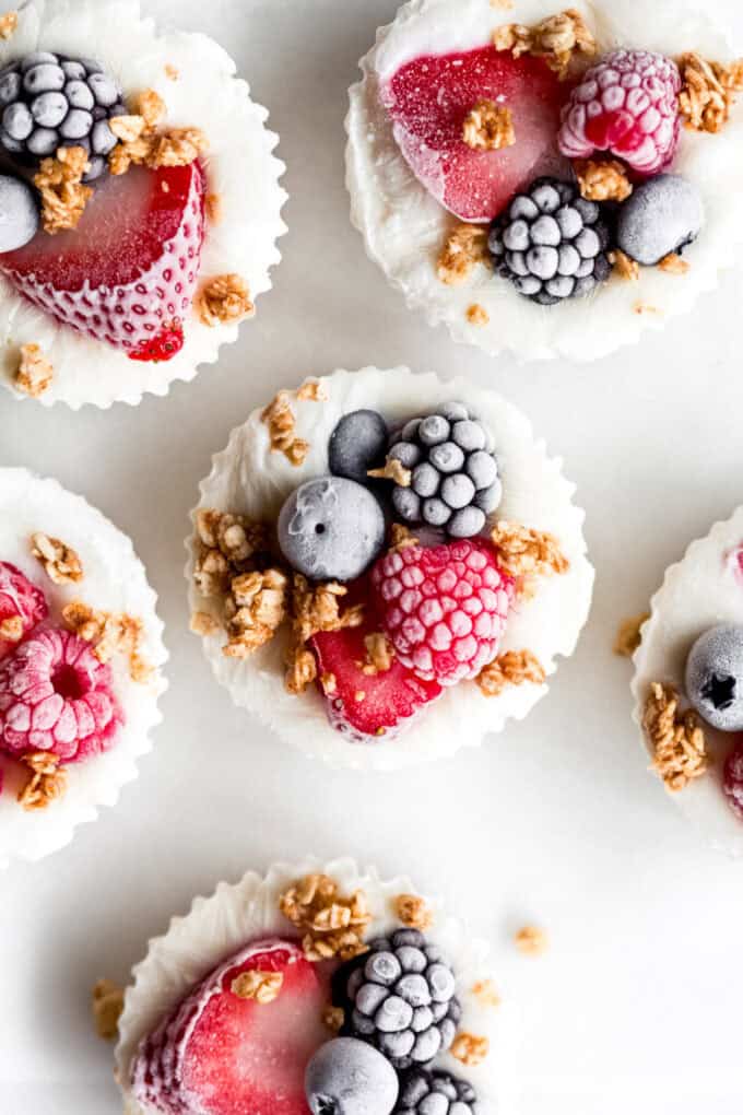 frozen yogurt granola cups topped with berries and granola