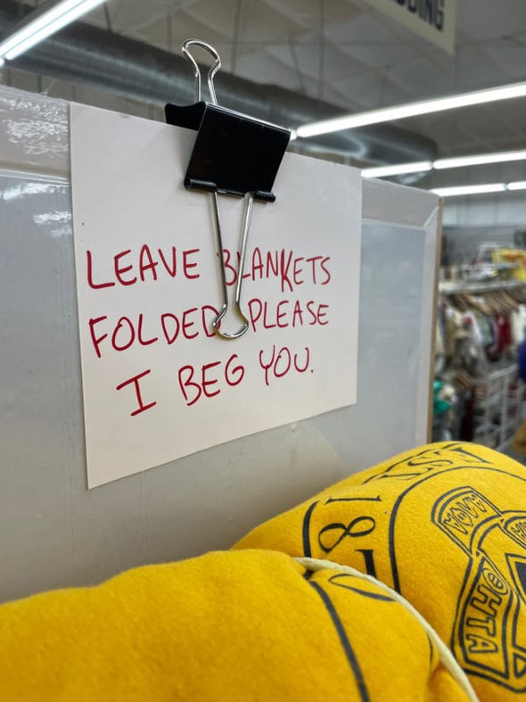 thrift store sign that says, 